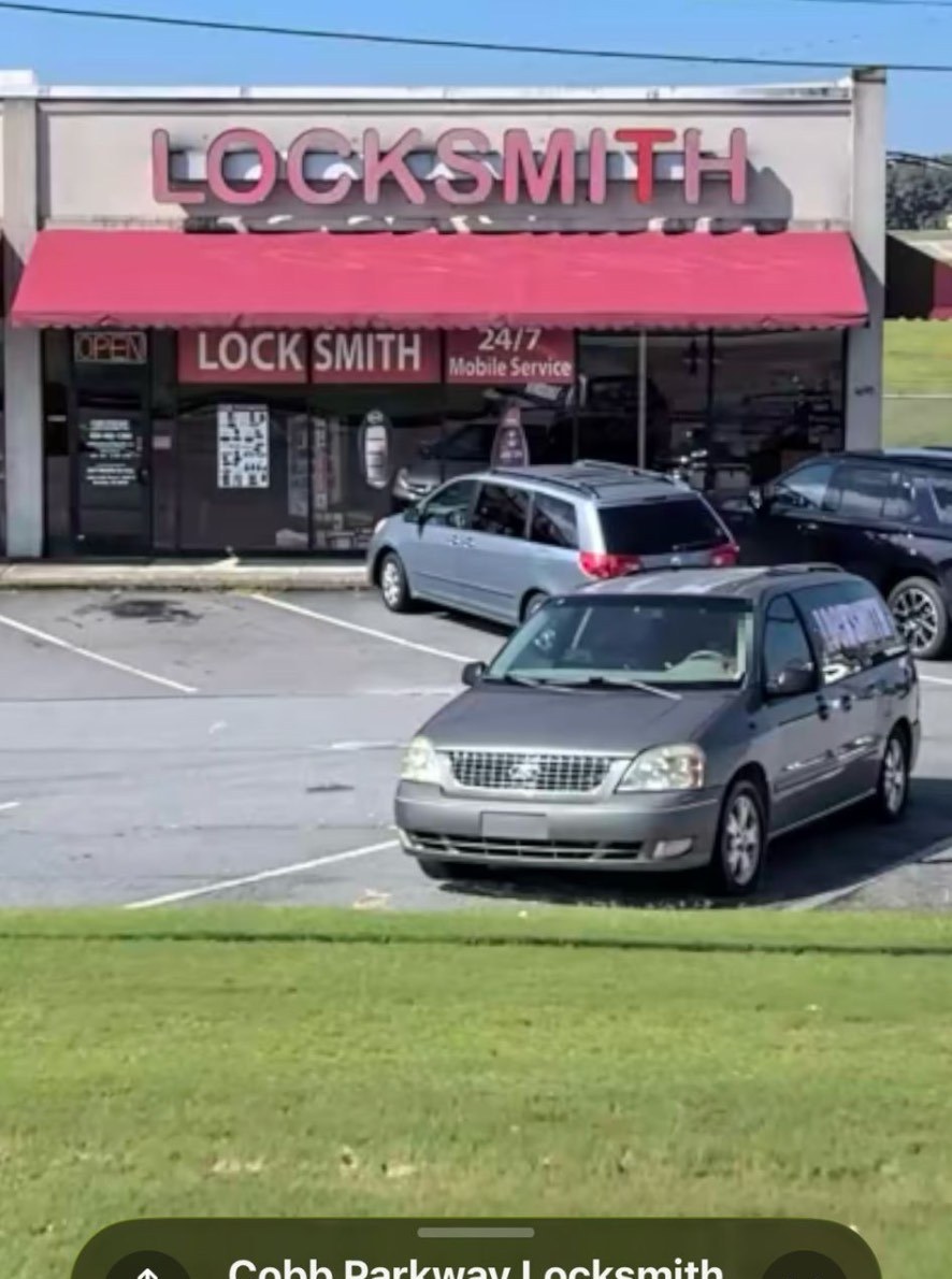 Storefront entrance with 24/7 mobile service signage